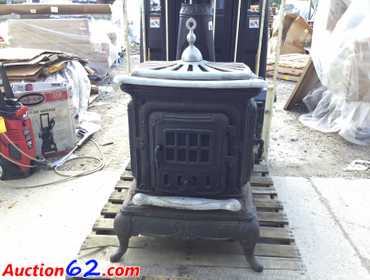 Auction62.com | Antique Cast Iron Wood Burning Parlor...