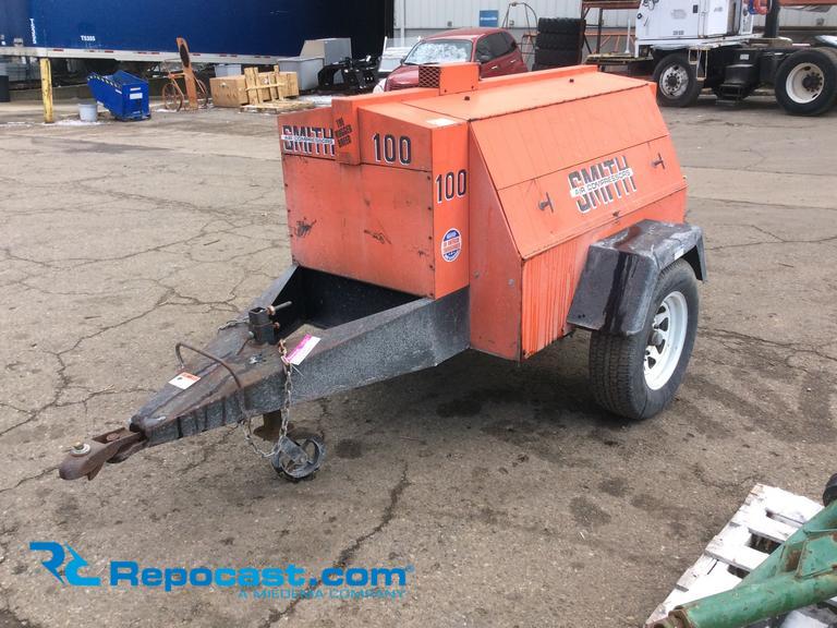 Smith 100 tow behind air compressor, model 100GP, has a Ford 5 liter engine, P215/75R tires, 2"...