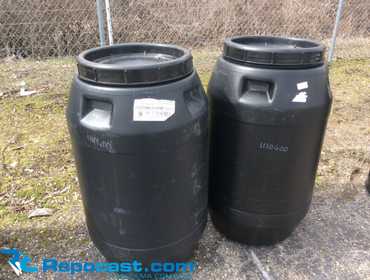 Lot of (2) 50-Gallon Black Plastic Barrels With Removable Lids And Twist On/Off Locking Rings,...