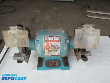Used Clarke Metal Worker 6'' bench grinder, model BT 1002, 120 volts, 3100 rpm, working condition.