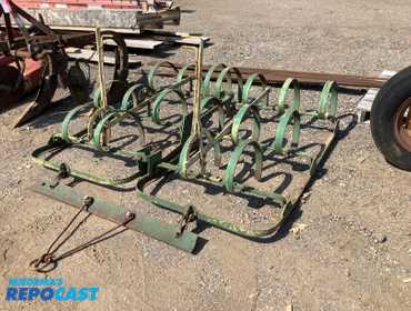 Tractor spring tooth harrow. Good condition, two section, six ft wide, adjustable depth gauge...