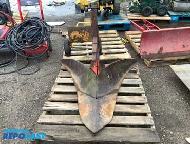 International Harvester tractor mounted on e point fast hitch middle buster, lister, ditcher in...