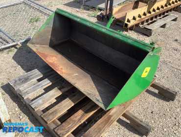 John Deere 48" loader bucket. Has front mower mounts attached, can be adapted to Deere Quick...