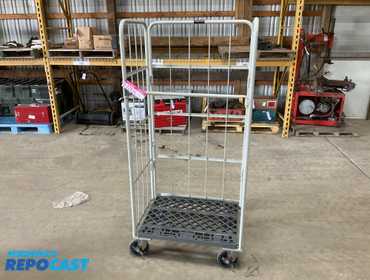 Folding metal tall cart on casters. Measures 31” wide x 24” deep x 67” tall. 
