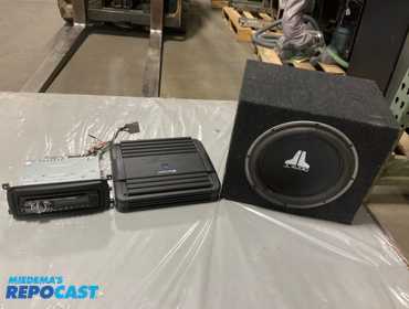 Tote of pioneer car stereo, alpine v-power amplifier, jl audio subwoofer
