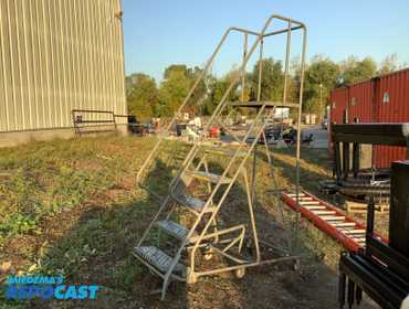 Industrial rolling staircase. Top platform height of 70”