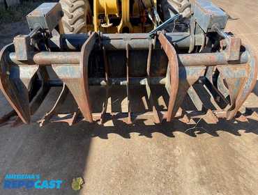 Used Bob Cat grapple s/n. 029400688, 82 1/2'' wide, has new couplers, and connecting hoses.