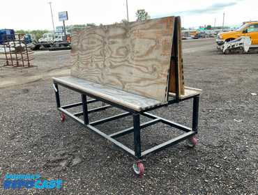 Metal frame work bench on casters 96” x 40” x 31”T at the table, plywood table top, has a tilted...