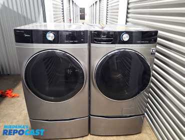 Matching Madia washer and dryer set. Front loading on riser stands. Electric dryer. 