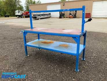Metal frame work bench with lower shelf 72”W x 30” x 37” to table top, has a bar mounted on the...