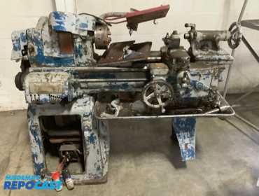 Large Industrial Lathe Approximately 54”x20”x50” cracked off a cast iron leg and a few wheels