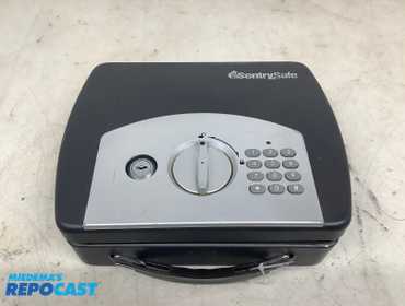 SentrySafe 10”x8”x3” miniature travel passcode/key operated safe, (needs batteries)
