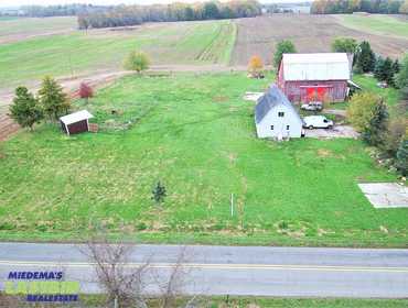 1 Bedroom, 1 Bath Living Quarters and Outbuildings on 2 Acres in Coopersville, MI