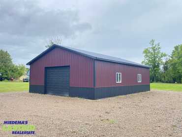 LASTBIDrealestate.com Online Real Estate Auction October 8, 2025 of a 0.72 acre lot with a 30 ft. x 40 ft pole building in Onaway, MI